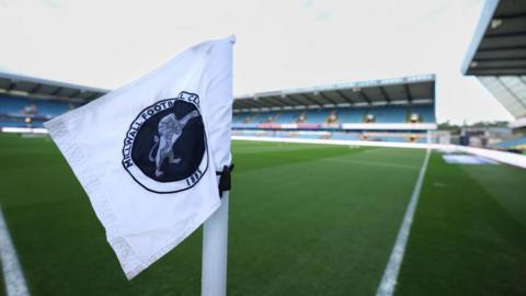 A corner flag showing the Millwall club crest at The Den