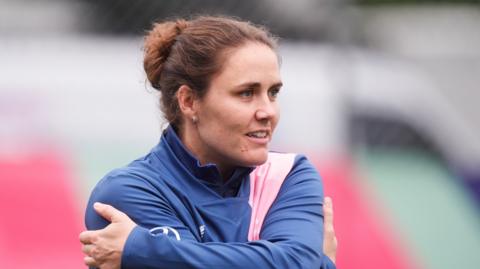 Nat Sciver-Brunt smiles during training