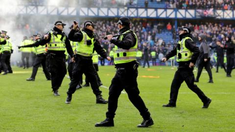Officers had to keep rival fans apart after the final whistle following Rangers' Scottish Cup match against Celtic at Ibrox in March