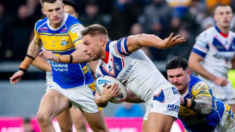 Wakefield's Matty Russell evades Leeds' James Bentley