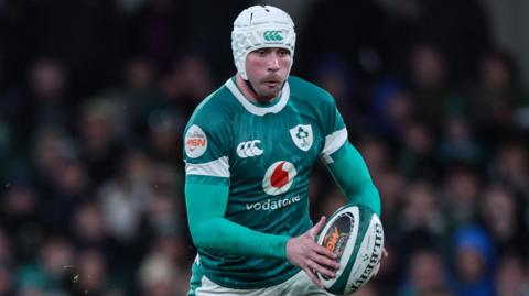 Mack Hansen in action for Ireland in this year's Six Nations