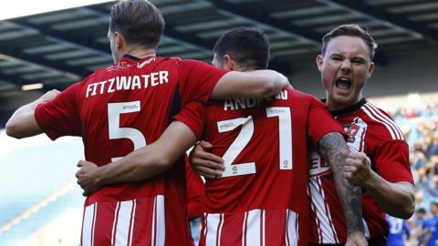 Exeter City celebrate scoring at Halifax Town