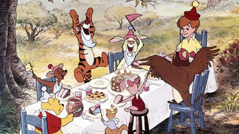 Characters from Winnie the Pooh having a tea party.