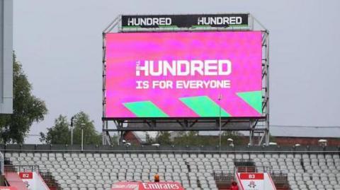 A screen at a match during The Hundred reads 'The Hundred is for everyone'