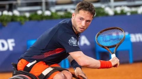 Alfie Hewett slices a backhand at the French Open