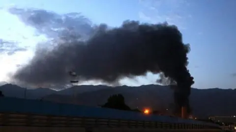 A plume of smoke in the sky