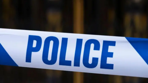 A generic image of blue and white police tape