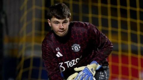 Goalkeeper Tom Myles in action for a Manchester United academy side
