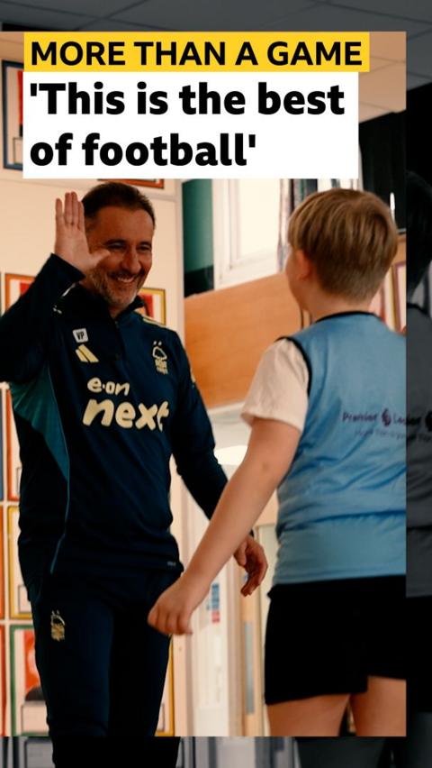 Vitor Pereira high fives a child