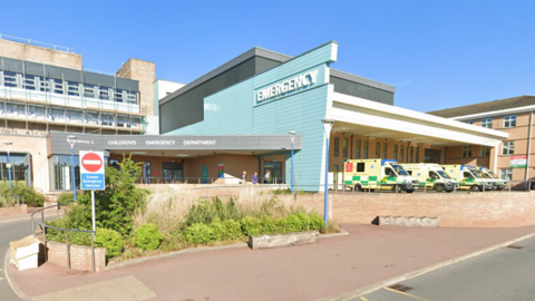 Street view image of Sunderland Royal Hospital's emergency department. There are ambulances outside.