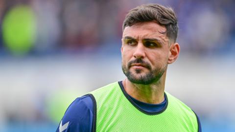 Swindon Town defender Ryan Tafazolli playing football