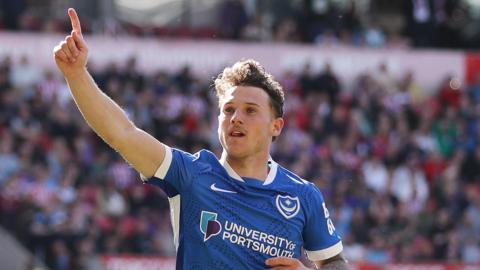 Portsmouth's Adrian Segecic has his hand up as he celebrates scoring against Stoke