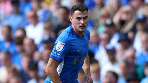 Regan Poole playing for Portsmouth in their game against Queens Park Rangers earlier this month