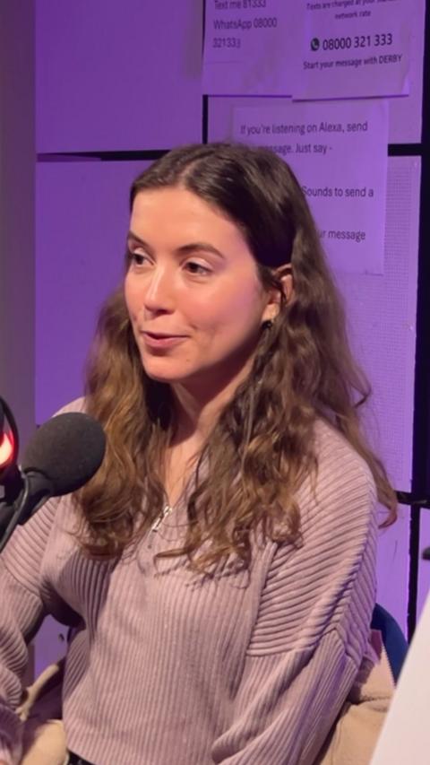 Amy Hudson sitting in the BBC Radio Derby studio