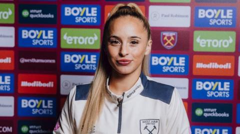 West Ham's Ria Bose poses in signing promo 