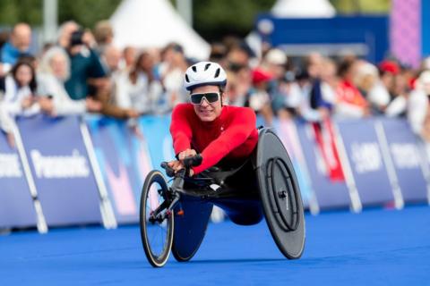 Catherine Debrunner after crossing the finishing line in the 2024 Paris Paralympics wheelchair marathon