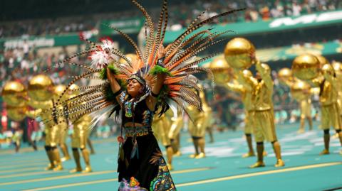 Performers during the opening ceremony before the match.