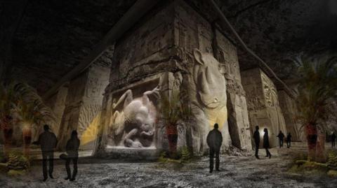 A CGI image of how the attraction would look inside the cavernous mine. The vast stone walls are carved with relief sculptures of animals including a frog and a rhino. Silhouettes of visitors are dwarfed by the exhibits.