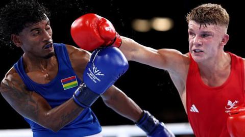 Owain Harris-Allan swings a punch at Niven Chemben