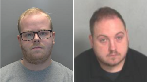 A custody image of Ethan Towers is on the left. He has short blond hair and is wearing black framed glasses and a grey T-shirt. He is standing in front of a grey wall. On the right is a custody image of John Watson who has short brown hair and is wearing a black T-shirt. He is sitting in front of a grey wall.
