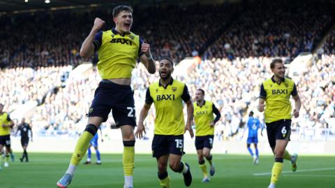 Oxford's Will Lankshear jumps in celebration at Sheffield Wednesday