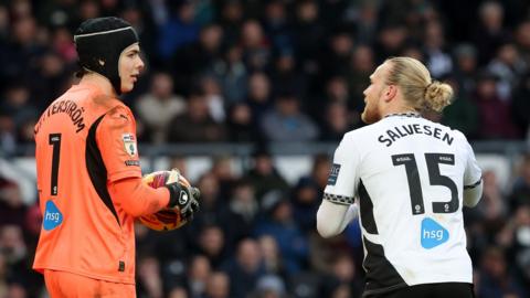 Derby players look at each other during a match