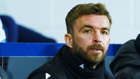 West Bromwich Albion head coach James Morrison watches on from the dug out during a game