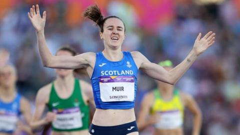 Laura Muir of Team Scotland celebrates winning the gold medal as they cross the finish line during the Women's 1500m Final on day ten of the Birmingham 2022 Commonwealth Games at Alexander Stadium