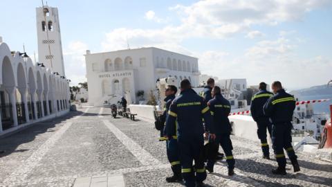 Firefighters in the nearly fully evacuated village of Fira in Santorini on Thursday