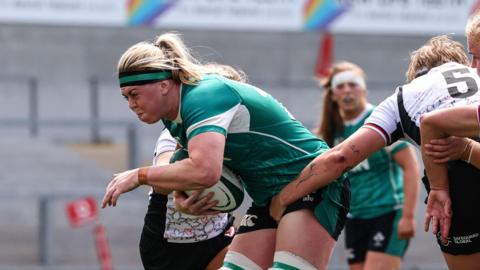 Ireland's Sam Monaghan breaks through a tackle against Canada 