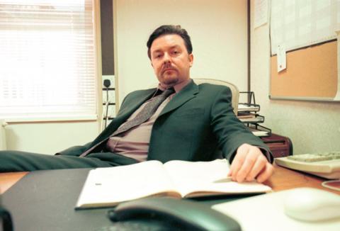 Ricky Gervais poses for a photo in his role as David Brent on the UK version of The Office