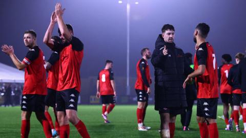 Truro City clap supporters