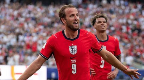 Harry Kane celebrates scoring for England