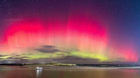 Red and green aurora light up skies above Northumberland