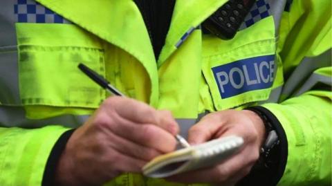 Police officer making notes