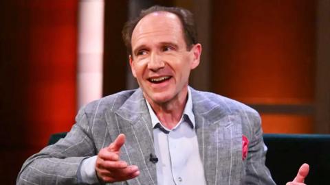 Ralph Fiennes sitting on the sofa on The Claudia Winkleman Show.