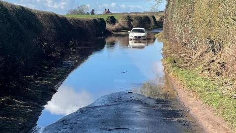 Car stuck in flood water 