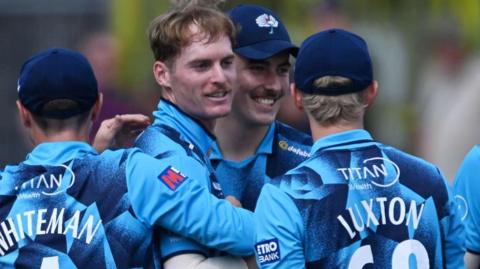Ben Cliff (second from left) celebrates with team-mates