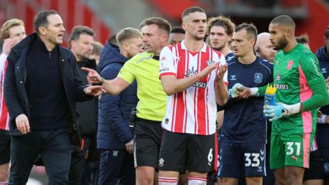 Coventry boss Frank Lampard approaches a match official following their game at Southampton