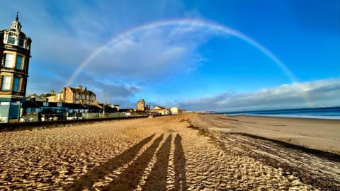 a rainbow over a beach