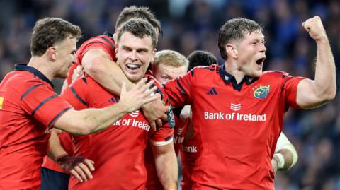 Shane Daly, Tom Farrell and Jack O'Donoghue celebrate scoring a try