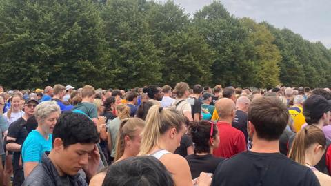 Thousands of people, runners and walkers gather at Bushy Park to mark the landmark 1,000th Parkrun at the place which held the first ever one.