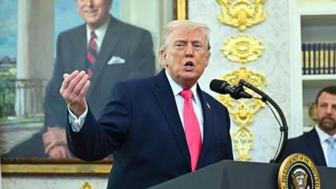 Dpnald Trump speaking to reporters