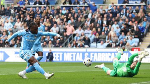 Coventry City's Brandon Thomas-Asante shoots past diving goalkeeper Ryan Allsop to give his team the lead over Birmingham City.