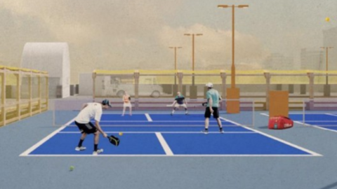 People playing pickleball on a blue court and wearing sports clothings.
