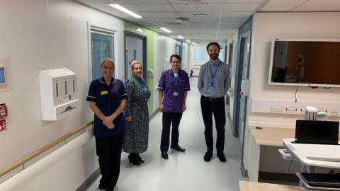 Deputy Ward Manager Sam Nicholson, Deputy Directorate Manager for Rehab and Elderly Medicine Tammy Steven, Nurse Consultant for Older Persons Chris Cairns and Senior Building Officer Andy Robson, in a hospital ward.