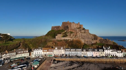 An aerial view of Gorey castle, the pier which hosts much of the fete is visible in the foreground.