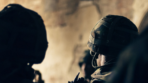 Generic image of the back of two soldiers heads