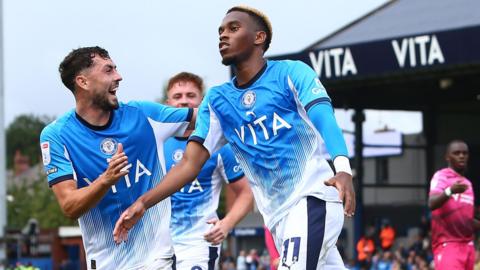 Malik Mothersille celebrates his goal for Stockport against Bolton