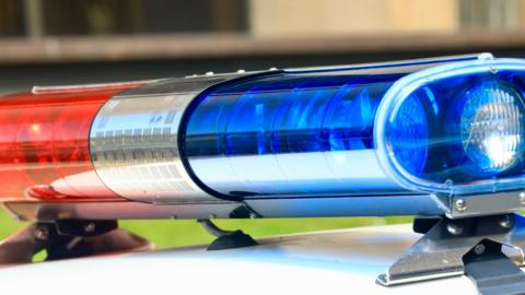 Blue and red lights on top of a police car.